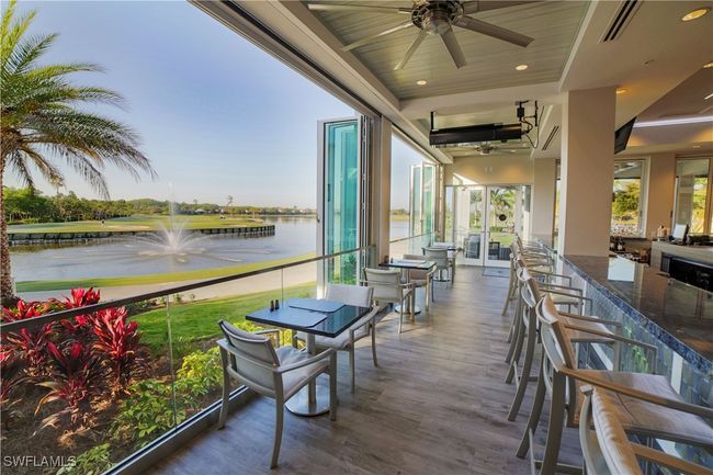 Wooden terrace featuring visible vents, a water view, and ceiling fan | Image 45