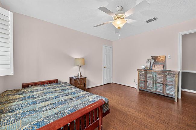 Another spacious bedroom with generous light, ceiling fan, and room to personalize. A quiet, comfortable haven to unwind or dream. | Image 34