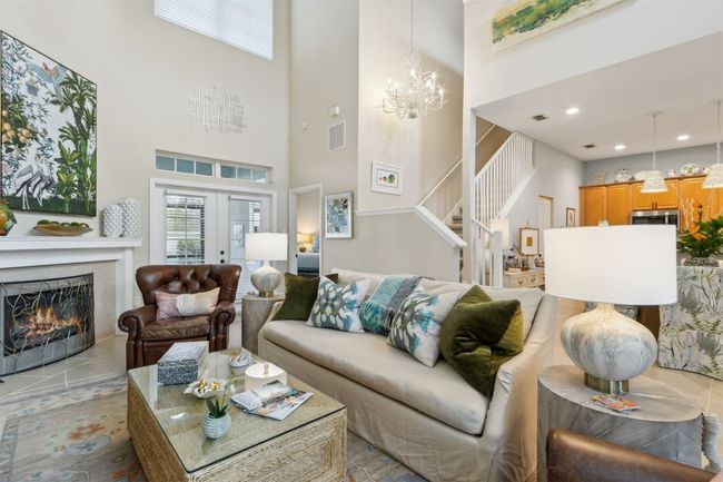 Abundant natural light enhancing the home's warm ambiance. | Image 4