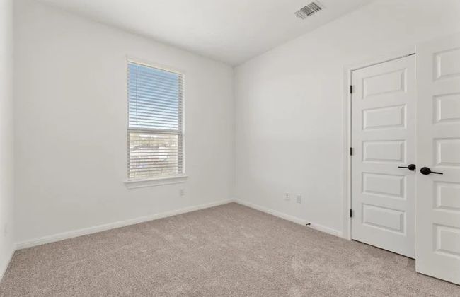 Unfurnished room featuring light colored carpet and baseboards | Image 12