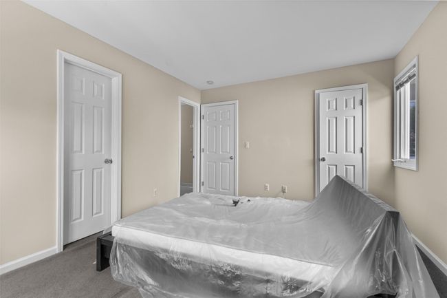 Carpeted bedroom with baseboards | Image 14