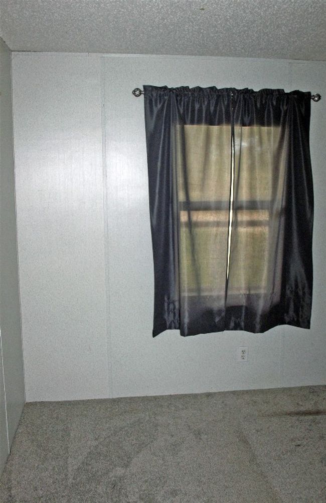 Carpeted spare room featuring a textured ceiling | Image 24
