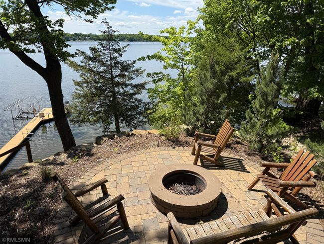 A lakeside built-in firepit will be your favorite spot to enjoy the Minnesota evenings. | Image 31