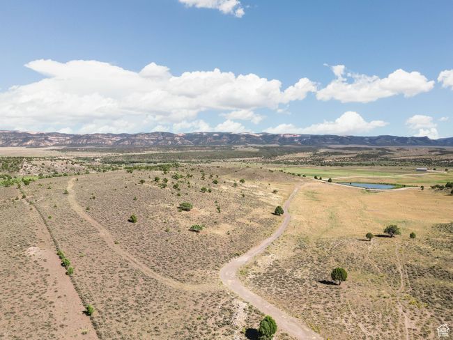 Aerial view of sparsely populated area with a water and mountain view | Image 13