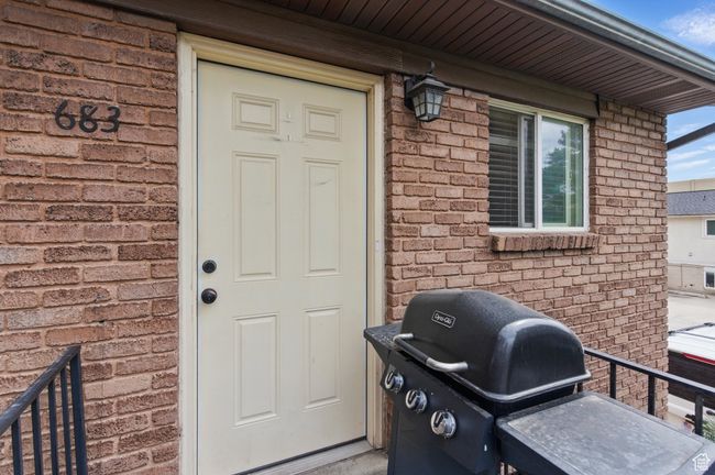 Property entrance with brick siding | Image 13