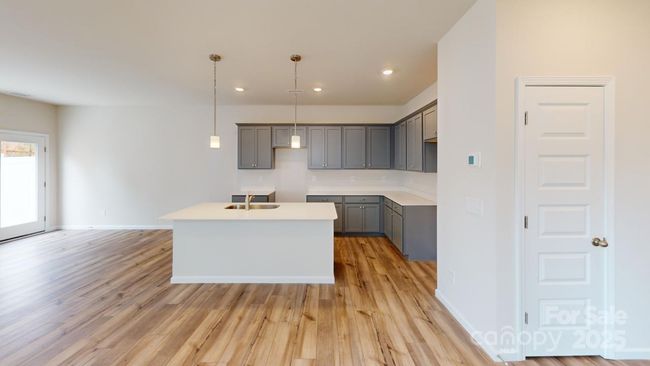Photo is representation - Open floor plan kitchen | Image 7
