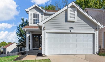 View of front of home with a garage | Image 1