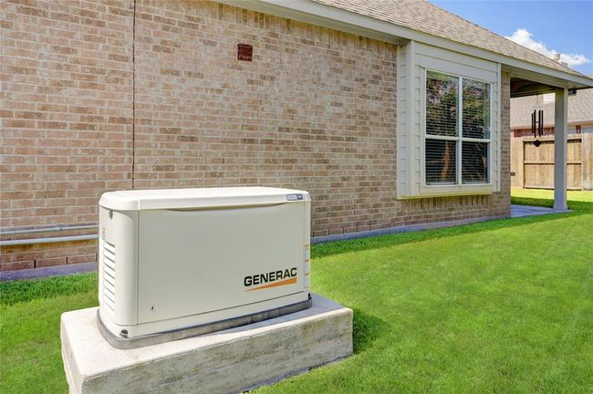 This home features boasts an 18KW Generac whole home generator, equipped for power outages and ideal for those with medical dependencies on consistent power. | Image 27