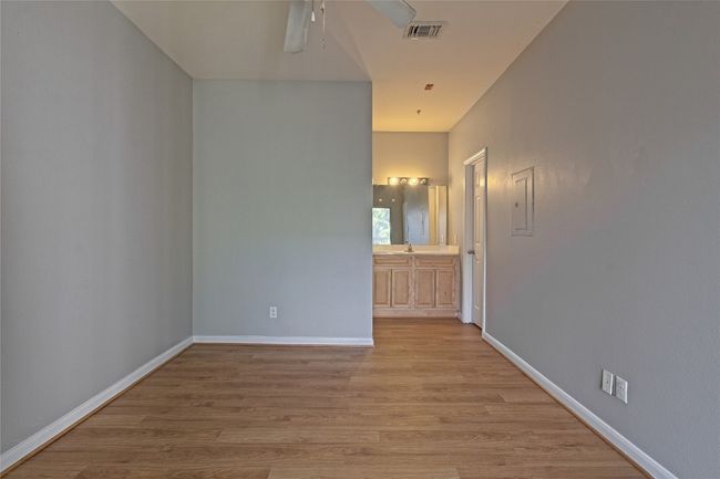 Spare room with light wood finished floors and ceiling fan | Image 24