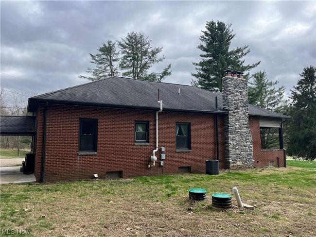 Back of house featuring central AC and a lawn | Image 6