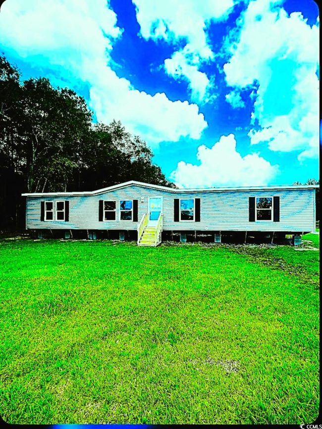 Manufactured / mobile home with entry steps and a front lawn | Image 5