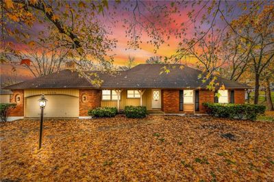 Single story home featuring a garage | Image 1