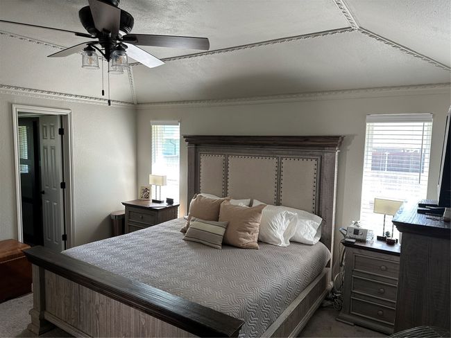 Bedroom featuring carpet flooring and ceiling fan | Image 23