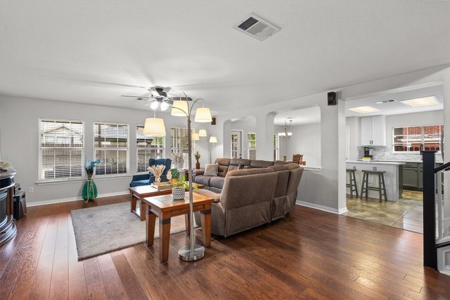 This living room features surround sound, great natural lighting and updated flooring. Smart light switches. | Image 9