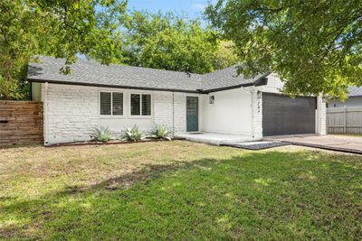 Curb appeal with this white home and black trim! Roof replaced in 2021. | Image 3