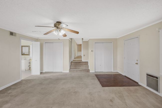 REC ROOM WITH DOUBLE CLOSETS AND ACCESS TO KITCHEN AND DEN COMBO. CEILING FAN. ACCESS TO SPACIOUS LAUNDRY AND STORAGE ROOM. WOULD MAKE EASY CONVERSION TO NEW PRIMARY AND EN SUITE. | Image 19