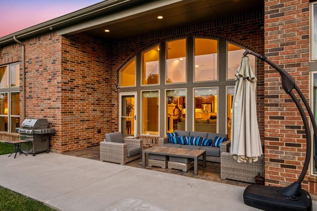 Sit back, relax and enjoy your gorgeous backyard under your large covered patio. Complete with recessed lighting, plenty of space for an outdoor kitchen or grilling station and outdoor seating. Your covered patio overlooks your huge backyard with plenty of green space for the kids and your furry friends to enjoy. | Image 33