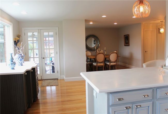 View from Kitchen of the Sunroom, Dining Area & Kitchen Island | Image 21