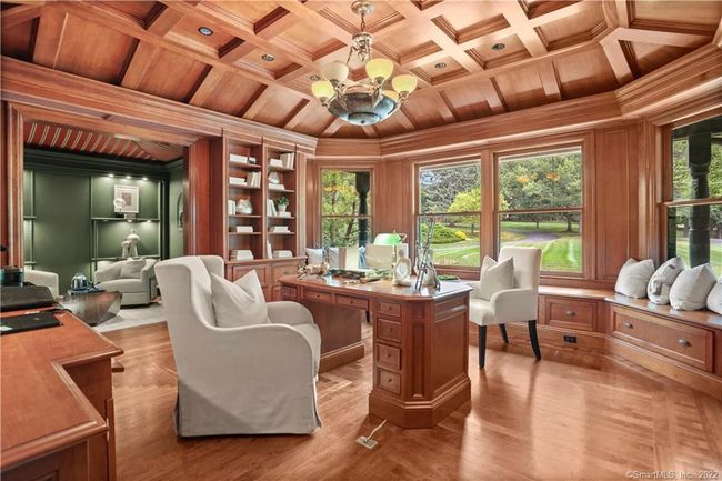 LIBRARY IN CHERRY // Superb library with custom cherry cabinetry, coffered ceiling and floors. Ante room with access to full bath. | Image 12