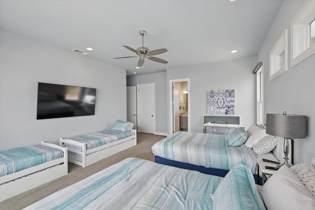 Bedroom featuring ceiling fan, visible vents, baseboards, carpet flooring, and recessed lighting | Image 37