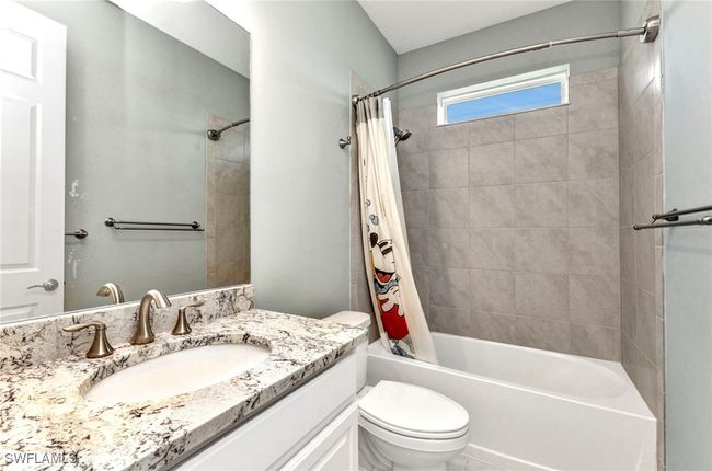 Full bathroom with shower / bath combo, toilet, and vanity | Image 31