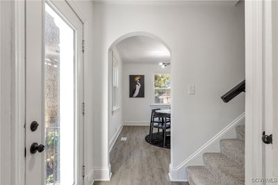 Entrance foyer with crown molding and light hardwood / wood-style flooring | Image 3