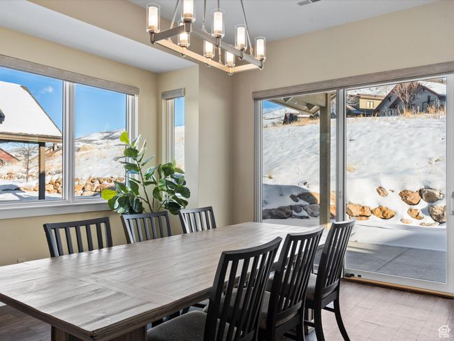 Dining room with plenty of natural light and a chandelier | Image 12