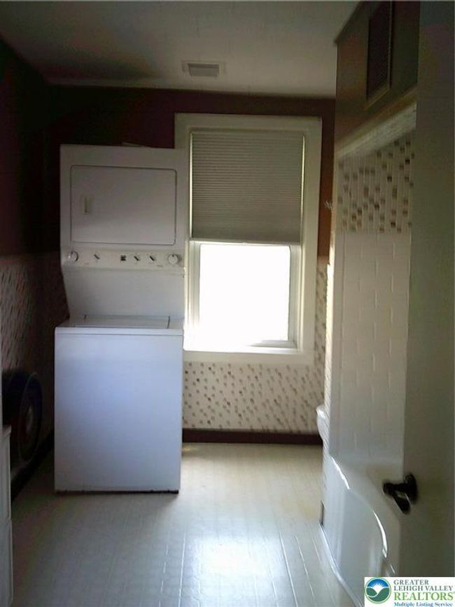 1st flr bathroom with stackable washer/dryer | Image 6
