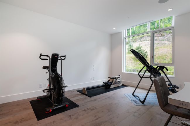 Exercise room with wood finished floors, plenty of natural light, and recessed lighting | Image 27