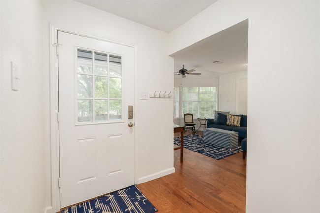 Entrance foyer featuring wood finished floors and a ceiling fan | Image 23