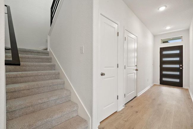 Entrance foyer with light wood finished floors, stairway, and recessed lighting | Image 9
