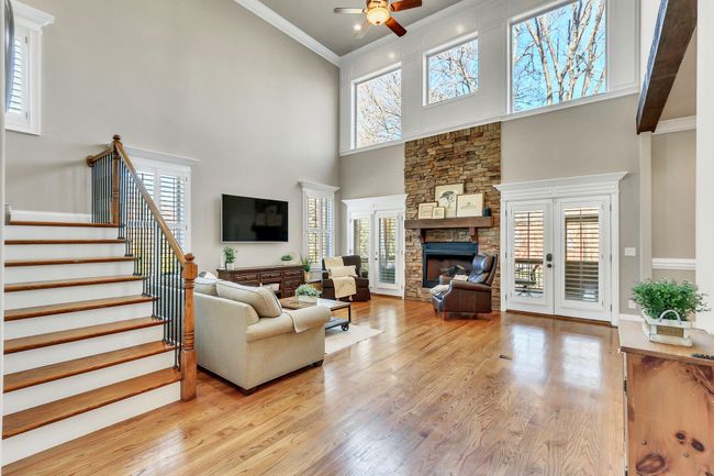 The great room is washed in sunlight from the oversized windows and double doors to your outdoor living spaces. | Image 10