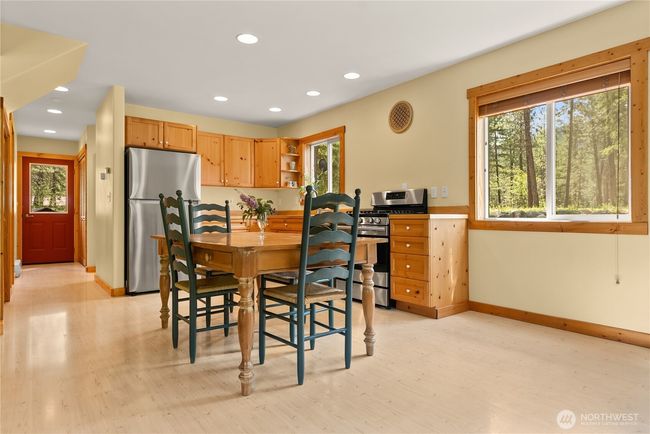 Open-concept kitchen, dining, and living area. | Image 18