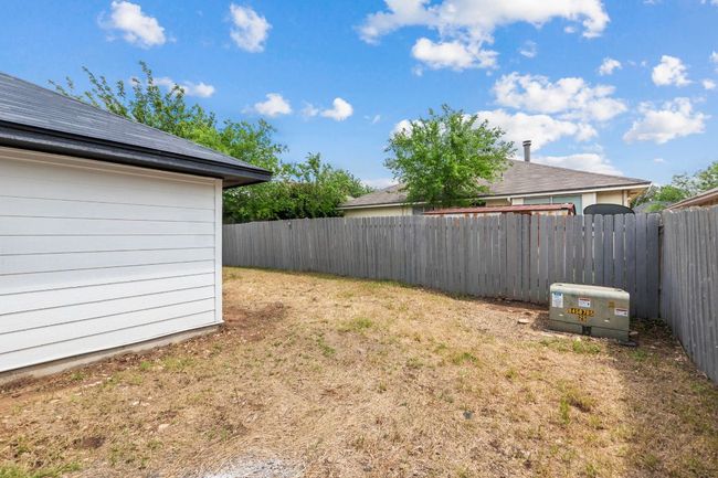 View of yard featuring a fenced backyard | Image 35