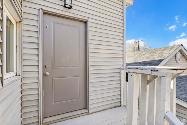 Entrance to property featuring a shingled roof | Image 6