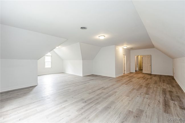 Additional living space featuring lofted ceiling, light wood finished floors, and baseboards | Image 29
