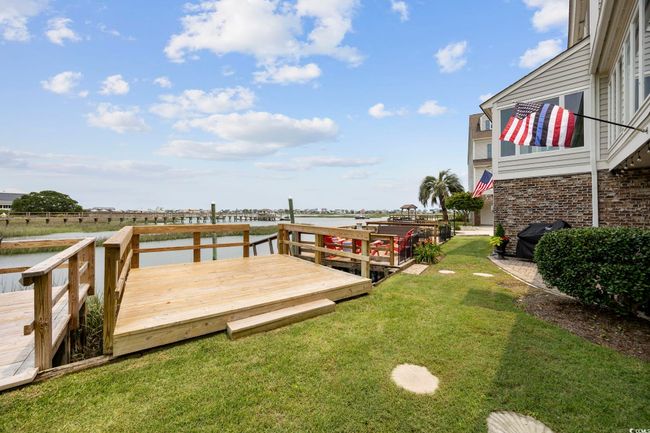 Dock with a yard and a deck with water view | Image 40