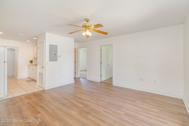 Unit #1230 has open floor plan.Two rightmost doors lead to the two bedrooms. | Image 15