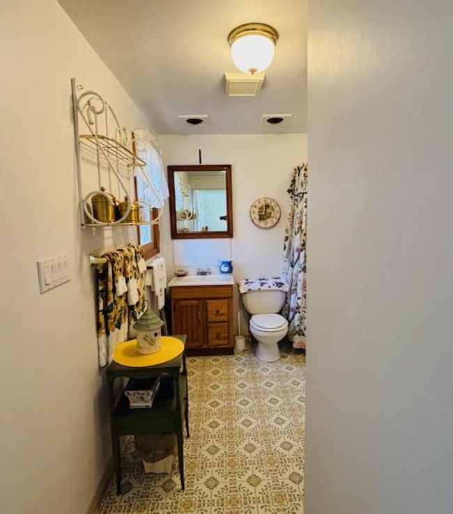 Bathroom featuring vanity and toilet | Image 14