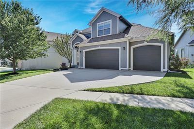 View of front of house with a garage and a front yard | Image 2