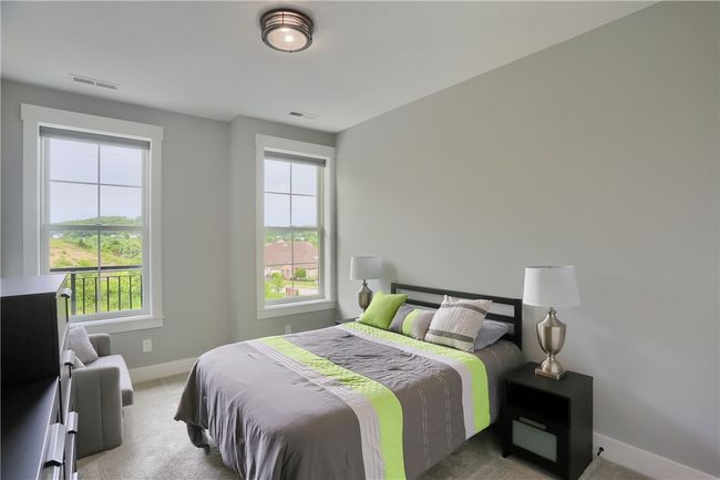 Large bedroom with two windows has great private views and enjoys a room flooded with natural light and oversized closet. | Image 36