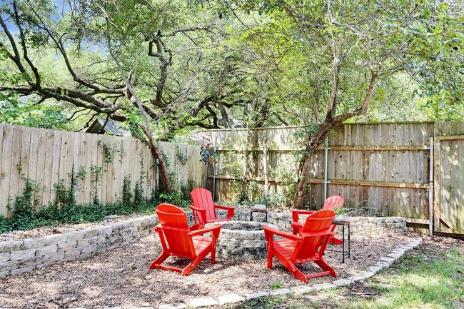 Fenced backyard featuring a fire pit | Image 33