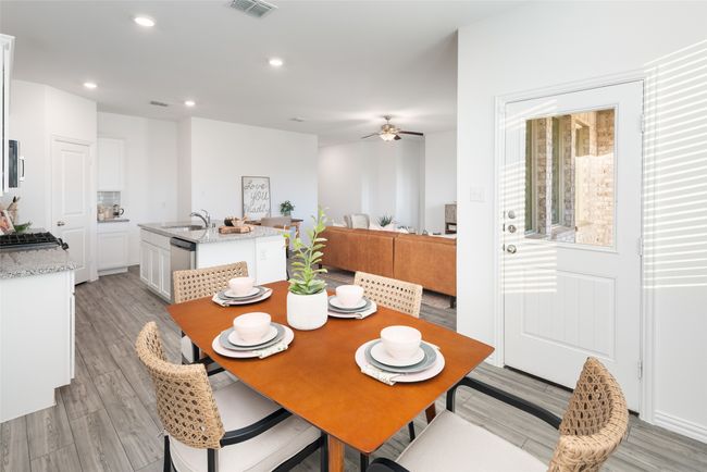 Dining area with ceiling fan, light wood-style floors, and recessed lighting | Image 12