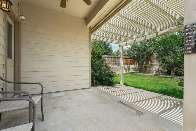 View of patio with ceiling fan and a pergola | Image 32
