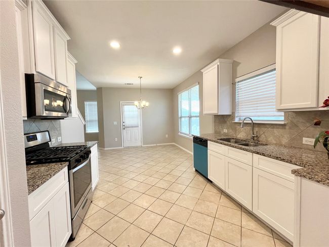 Kitchen and side door to patio | Image 6