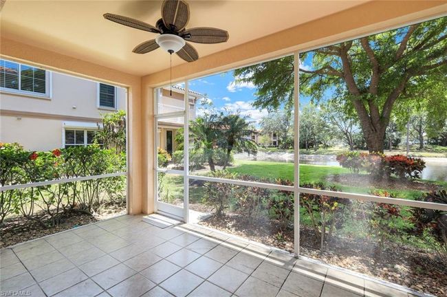 tile patterned flooring, a water view, ceiling fan, and a wealth of natural light | Image 17