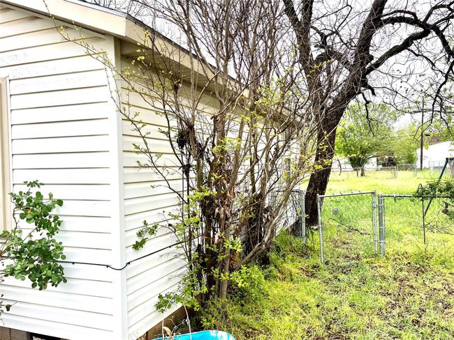 View of home's exterior featuring a gate | Image 13