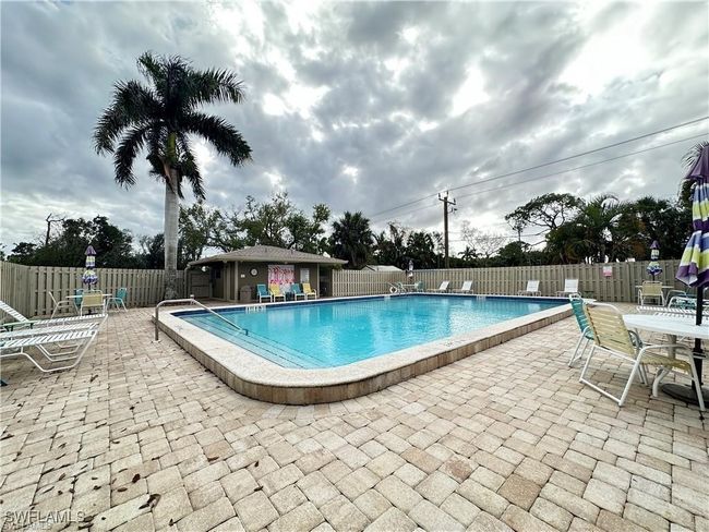 Community pool with a patio and a fenced backyard | Image 31
