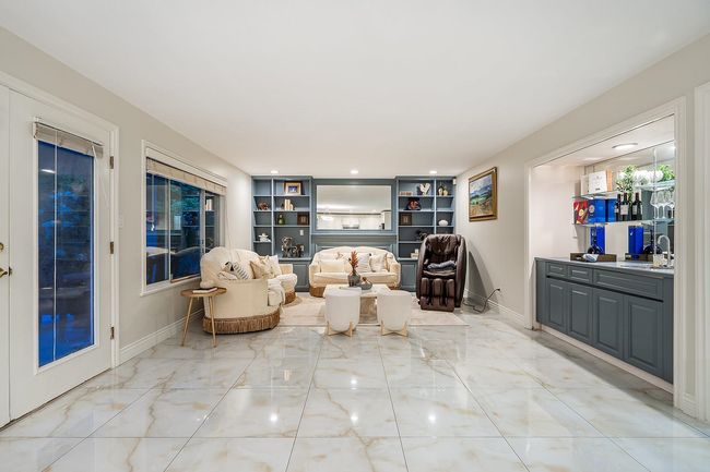 Living area with light marble finish floors, baseboards, and recessed lighting | Image 13