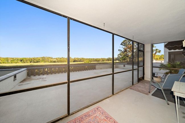 Screened Patio Overlooking Your Balcony and Golf Course | Image 25
